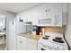Efficient kitchen features white cabinets, granite countertops, and appliances at 304 North Ocean Blvd. # 506, North Myrtle Beach, SC 29582