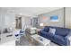 Living room with sofa, television, and view of the bedroom at 304 North Ocean Blvd. # 506, North Myrtle Beach, SC 29582
