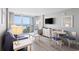 Bright living area showcasing neutral paint, ocean view balcony access, and modern furniture at 304 North Ocean Blvd. # 506, North Myrtle Beach, SC 29582