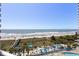Stunning ocean view from the balcony overlooking the beach, pool, and ocean at 304 North Ocean Blvd. # 506, North Myrtle Beach, SC 29582