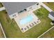 Aerial view of a home with a pool, outdoor kitchen, and well-manicured lawn at 322 Canyon Dr., Conway, SC 29526