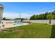 Large backyard featuring an in-ground pool, well-maintained lawn, and privacy fence at 322 Canyon Dr., Conway, SC 29526