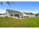 Backyard featuring a swimming pool, patio area, and lush lawn, perfect for outdoor enjoyment at 322 Canyon Dr., Conway, SC 29526