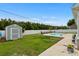 Expansive backyard showcasing a pool, shed, and lush green lawn, ideal for outdoor activities at 322 Canyon Dr., Conway, SC 29526