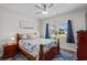 Comfortable bedroom with ceiling fan, a full sized bed and view to the backyard at 322 Canyon Dr., Conway, SC 29526