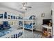 Bright bedroom with bunk beds, a ceiling fan, and a peek into the backyard at 322 Canyon Dr., Conway, SC 29526
