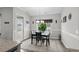 Cozy dining area with table, chairs, large window and door access to the outdoor area at 322 Canyon Dr., Conway, SC 29526
