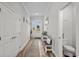 Neutral entryway featuring light walls, a hall table, and a half-bath at 322 Canyon Dr., Conway, SC 29526