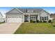 Charming single story home with a manicured lawn, a two car garage, and lovely curb appeal at 322 Canyon Dr., Conway, SC 29526