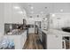 Open kitchen with island, granite countertops, stainless steel appliances, and adjacent living space at 322 Canyon Dr., Conway, SC 29526