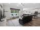 Bright, neutral living room with view of the pool, and an open concept leading to the kitchen at 322 Canyon Dr., Conway, SC 29526