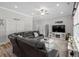 Bright living room featuring a ceiling fan, a flat screen television, and a gray leather couch at 322 Canyon Dr., Conway, SC 29526