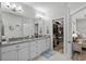 Main bathroom with double vanity, granite countertops, and a view into the walk-in closet at 322 Canyon Dr., Conway, SC 29526
