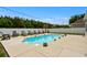 Inviting backyard pool area with lounge chairs, privacy fence, and ample space for relaxation and entertaining at 322 Canyon Dr., Conway, SC 29526