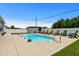 Clean in-ground pool with patio, surrounded by a fenced yard with chairs and a shed at 322 Canyon Dr., Conway, SC 29526
