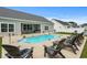 Backyard featuring an in-ground pool surrounded by lounge chairs and a well-manicured lawn at 322 Canyon Dr., Conway, SC 29526