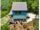 Unique, contemporary home boasts an architectural roof and beautiful landscaping on a private lot surrounded by trees at 329 Kaufman St., Georgetown, SC 29440
