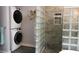 Modern bathroom features glass block shower, stackable washer and dryer and stone tile details at 329 Kaufman St., Georgetown, SC 29440