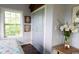 Bedroom featuring a light blue wall with white trim, large windows and a closet at 329 Kaufman St., Georgetown, SC 29440