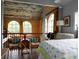 Bedroom with unique ceiling, wood paneled walls, and large arched windows offer bright natural light and views at 329 Kaufman St., Georgetown, SC 29440