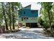 Stylish, modern home with unique architecture, open carport, and beautiful curb appeal in a nature-filled setting at 329 Kaufman St., Georgetown, SC 29440