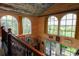 Bright, open interior with large arched windows offering scenic views, complemented by warm wood finishes at 329 Kaufman St., Georgetown, SC 29440