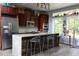 Modern kitchen with dark wood cabinets, stainless steel appliances, and a marble-topped island at 329 Kaufman St., Georgetown, SC 29440