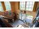 Bright living room features wood paneled walls, a unique painted ceiling, and a stairway to the second floor at 329 Kaufman St., Georgetown, SC 29440