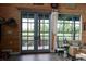 Bright living room with wood paneling, patio access, and marsh views at 329 Kauffman St., Georgetown, SC 29440