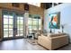 Spacious living room with high ceilings, wood paneling, and an exterior view through sliding glass doors at 329 Kaufman St., Georgetown, SC 29440