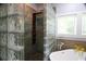 Contemporary glass block shower with mosaic tile flooring at 329 Kauffman St., Georgetown, SC 29440