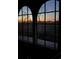 Dusk view of the landscape from arched paned window at 329 Kauffman St., Georgetown, SC 29440