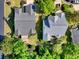 Aerial view of the two houses with lush green lawns and mature trees at 4 Stillwater Ct., Murrells Inlet, SC 29576