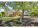 Landscaped backyard featuring a pergola, patio, and lush green lawn providing an outdoor living space at 4 Stillwater Ct., Murrells Inlet, SC 29576