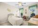 Bright bedroom featuring a comfy single bed, ceiling fan, and a traditional desk with a chair at 4 Stillwater Ct., Murrells Inlet, SC 29576