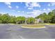 Community building with mature trees in a roundabout at 4 Stillwater Ct., Murrells Inlet, SC 29576
