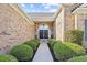 Inviting front entryway featuring double doors, lush landscaping, and a walkway leading to the entrance at 4 Stillwater Ct., Murrells Inlet, SC 29576