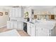 A kitchen boasting white marble counters, ample cabinet space and modern appliances at 4 Stillwater Ct., Murrells Inlet, SC 29576