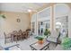 Cozy covered patio with a ceiling fan, dining set, and comfortable outdoor seating area at 4 Stillwater Ct., Murrells Inlet, SC 29576
