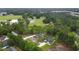 An aerial view of two homes amongst mature trees and green space at 4120 Whatuthink Rd., Myrtle Beach, SC 29588