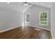 Bedroom with vaulted ceiling, ceiling fan, and two windows providing natural light and views at 4120 Whatuthink Rd., Myrtle Beach, SC 29588