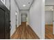 Bright entryway with hardwood floors and doorways leading to various rooms, welcoming guests at 4120 Whatuthink Rd., Myrtle Beach, SC 29588