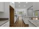 Open kitchen with an island and modern appliances flowing into a dining area with natural light at 4120 Whatuthink Rd., Myrtle Beach, SC 29588