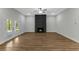 Cozy living room featuring a modern fireplace, hardwood floors, and French doors to the backyard at 4120 Whatuthink Rd., Myrtle Beach, SC 29588