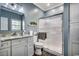 Stylish bathroom with a framed glass shower door, granite countertop, and vanity at 4294 Rivergate Ln., Little River, SC 29566