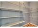 Walk-in closet with many adjustable shelves at 4294 Rivergate Ln., Little River, SC 29566