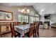 Formal dining room with hardwood floors, shuttered windows, chandelier, and fireplace at 4294 Rivergate Ln., Little River, SC 29566