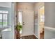 Inviting foyer with wood-look flooring and a view into a bedroom and kitchen, creating a warm welcome at 4294 Rivergate Ln., Little River, SC 29566
