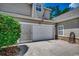 Spacious garage with an American flag detail and charming stone accents and well-maintained landscaping at 4294 Rivergate Ln., Little River, SC 29566