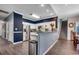 Kitchen with stainless steel appliances, modern cabinets, breakfast bar, and staircase at 4294 Rivergate Ln., Little River, SC 29566